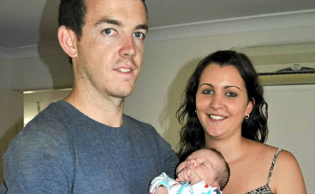 Tim Keogh, with partner Jacinta Ryan and four-week-old son Cooper, is settling into life in Warwick. 